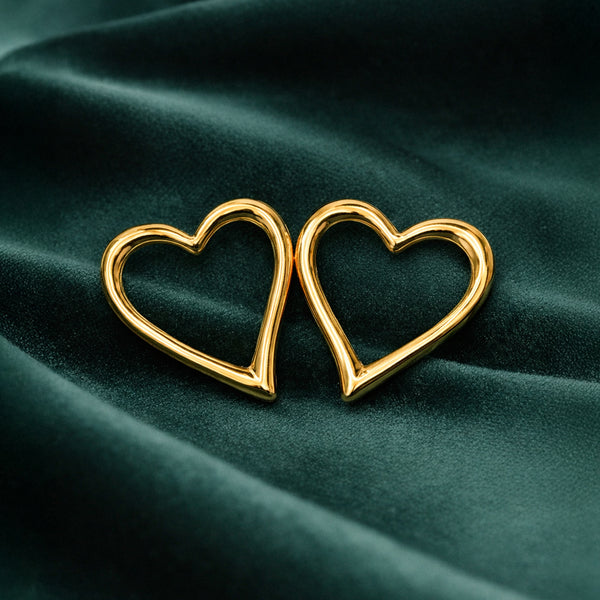 Anti-Tarnish Gold Plated Heart Earrings by House of Viya on dark green fabric background