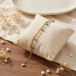 Anti-Tarnish Gold Plated Snake Chain Green Aura Beads Bracelet by House of Viya on cushion with pearls
