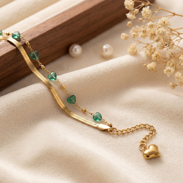 Close-up of Anti-Tarnish Gold Plated Snake Chain Bracelet with green aura beads and heart charm - House of Viya