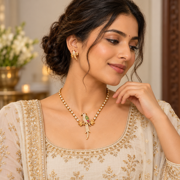 Model wearing CZ parrot pendant necklace and parrot stud earrings with ivory outfit