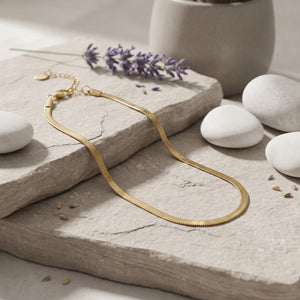 Anti-Tarnish Gold Plated Snake Chain Anklet on stone surface with lavender - House of Viya
