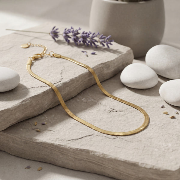 Anti-Tarnish Gold Plated Snake Chain Anklet on stone surface with lavender - House of Viya