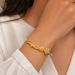 Kadas Gold-Tone Openable Floral Motif Kada with Crystal-Studded Flower Accent - Polished Finish Bypass Cuff Bracelet