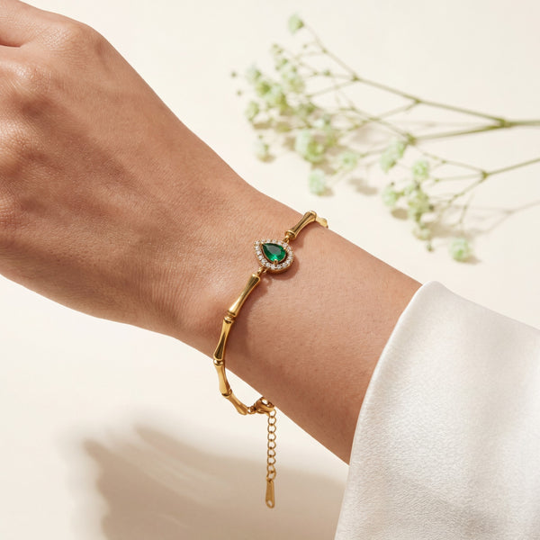 Gold Plated Bamboo Bar Link Bracelet with Side Oval Green Stone Halo Accent and Lobster Clasp
