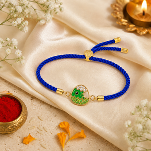 18K Gold Plated Rakhi Stone-Studded Dinosaur Egg Motif Kids Rakhi - House of Viya