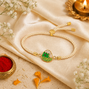 18K Gold Plated Rakhi Stone-Studded Dinosaur Egg Motif Kids Rakhi - House of Viya