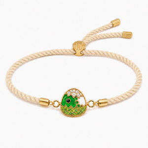 18K Gold Plated Rakhi Stone-Studded Dinosaur Egg Motif Kids Rakhi - House of Viya