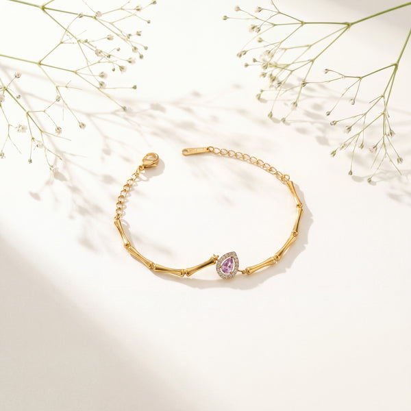Gold Plated Bamboo Bar Link Bracelet with Oval Pink Stone Halo Centrepiece and Lobster Clasp