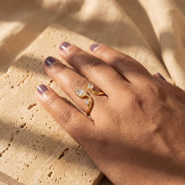 Woman Wearing Dual Pear CZ Open Bypass Ring – Gold Plated Twin Teardrop Statement Ring on Hand by House of Viya
