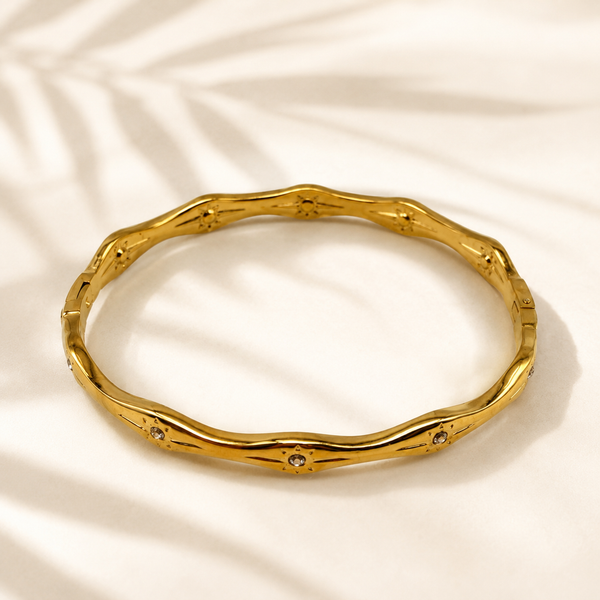 Gold Wavy Ripple Edge Scattered Diamond Oval Kada for Women | Curved Band Stone Stainless Steel Ladies Bangle | Artistic Festive Jewellery - House of Viya